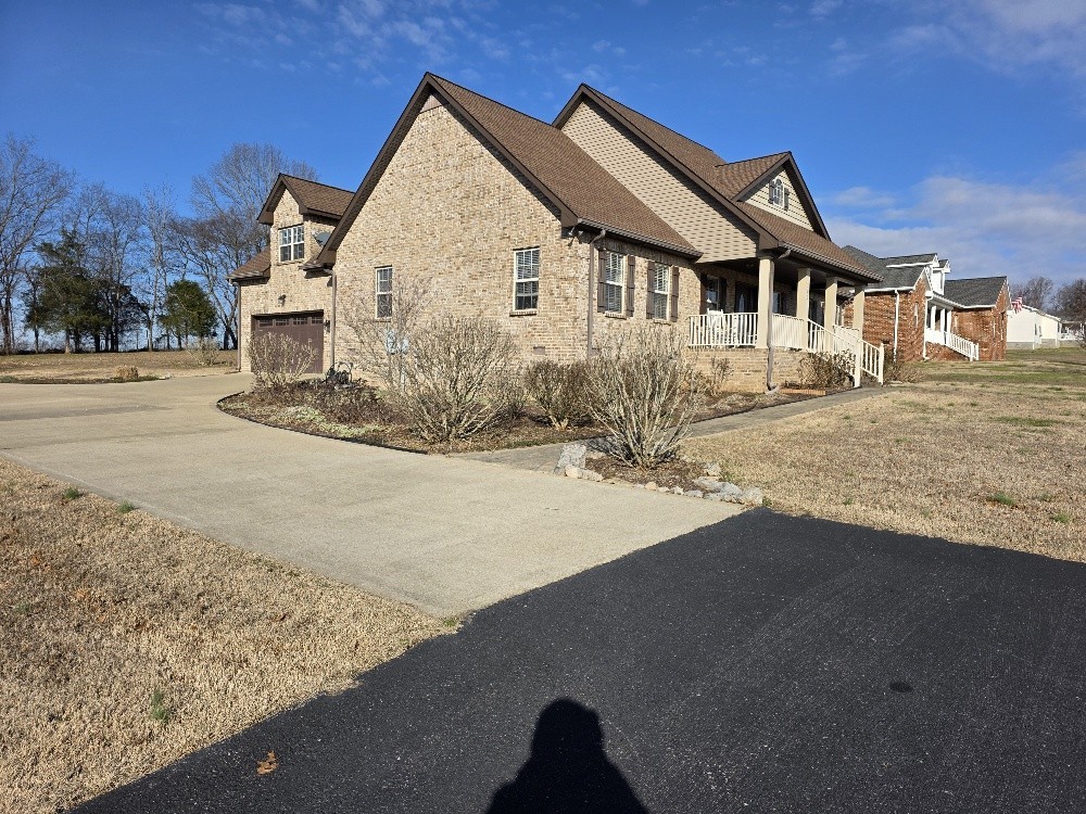 100 Ladybug Lane Bethpage, TN 37022 - Photo 8 of 56 a front view of a house with a yard