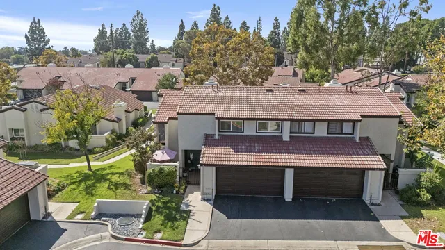 an aerial view of a house with a garden