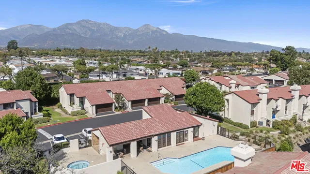an aerial view of residential houses and outdoor space