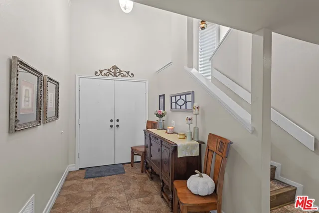 a room with a washing machine and a shower