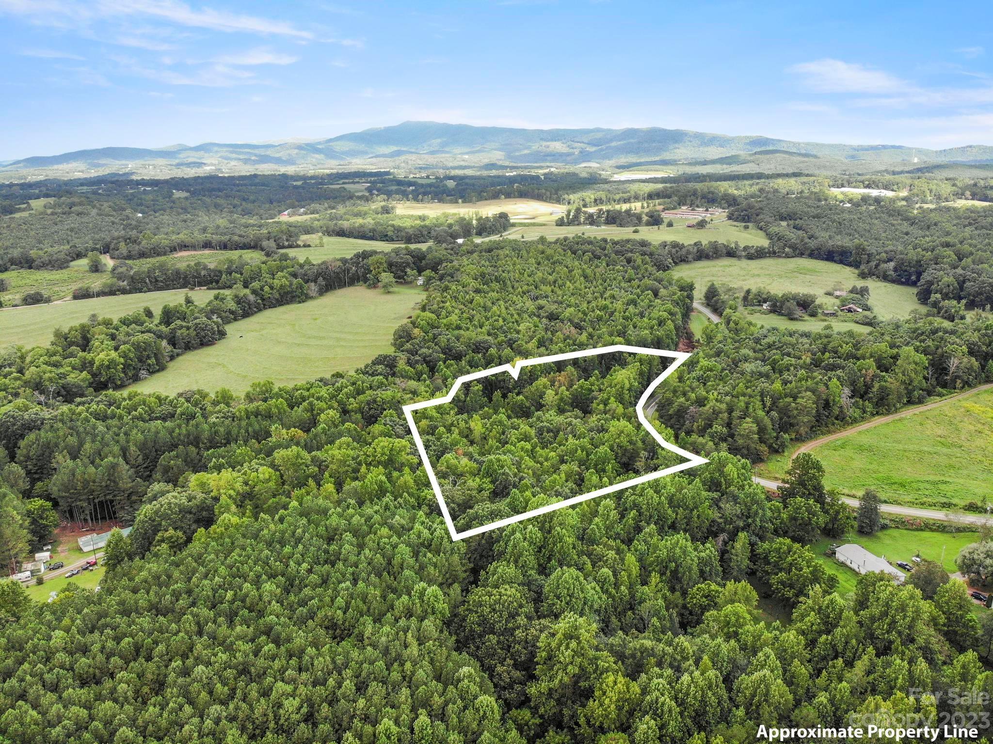 601 St Paul Church Road Casar, NC 28020 - Photo 25 of 33 an aerial view of ocean with residential houses with outdoor space and swimming pool