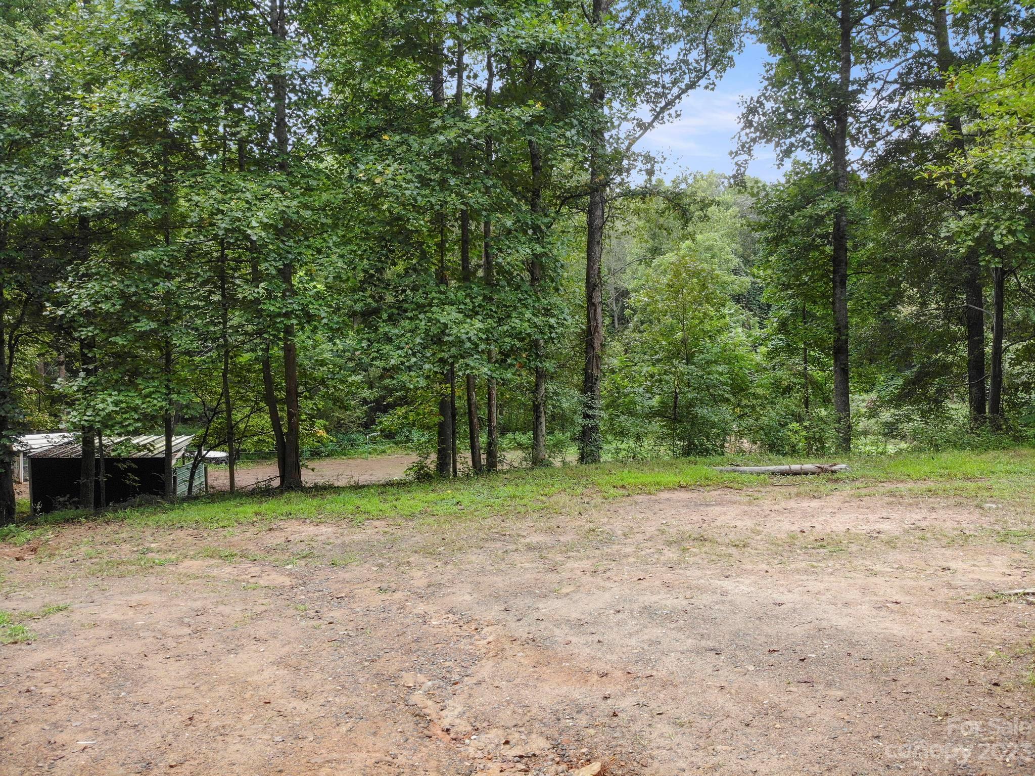 601 St Paul Church Road Casar, NC 28020 - Photo 5 of 33 a view of a field with trees in the background