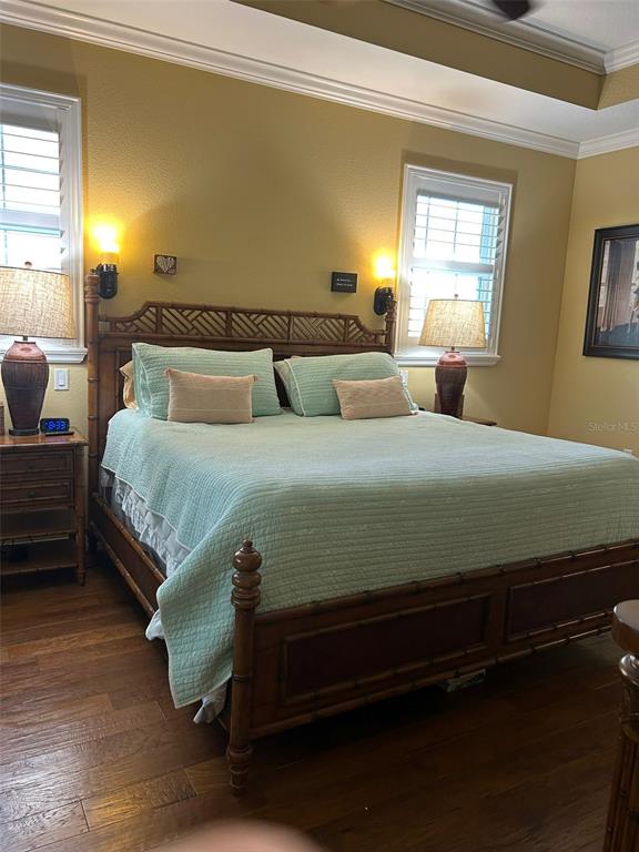 8979 Southwest 86th Loop Ocala, FL 34481 - Photo 13 of 28 a bedroom with a bed and a dresser next to a window
