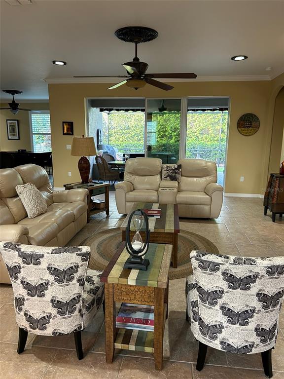 8979 Southwest 86th Loop Ocala, FL 34481 - Photo 7 of 28 a living room with furniture and a large window