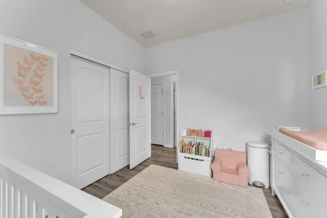 a bedroom with a bed and a closet