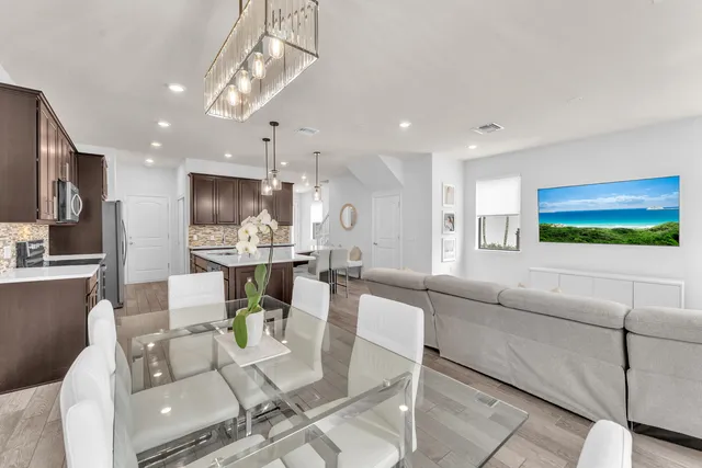 a living room with fireplace furniture and a flat screen tv