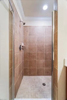 a bathroom with a shower and a sink