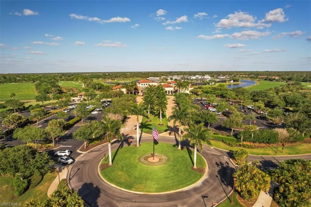 9830 Giaveno Circle, Unit 1622 Naples, FL 34113 - Photo 23 of 43 an aerial view of residential houses with outdoor space
