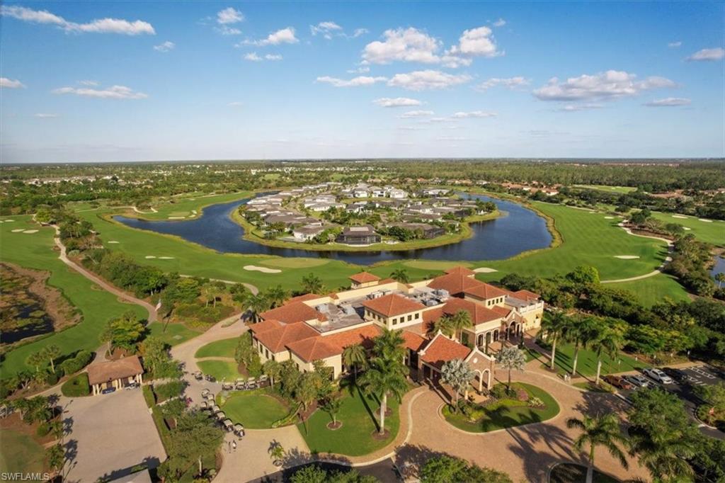 9830 Giaveno Circle, Unit 1622 Naples, FL 34113 - Photo 24 of 43 a view of a lake with a beach