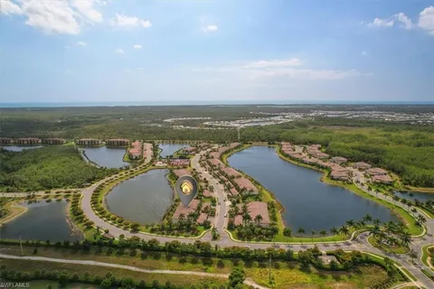 an aerial view of a house with a lake view