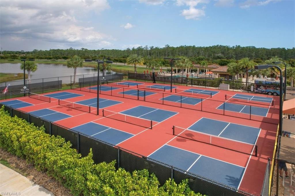 9830 Giaveno Circle, Unit 1622 Naples, FL 34113 - Photo 34 of 43 a outdoor space with pool and city view