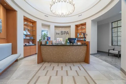 a view of a room with gym equipment and a large window