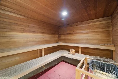 a view of a dining room with tables and chairs