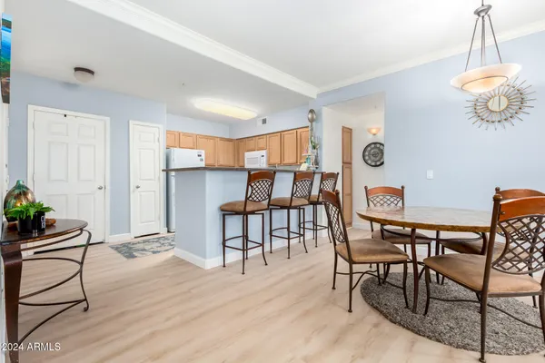 a dining room with furniture and window