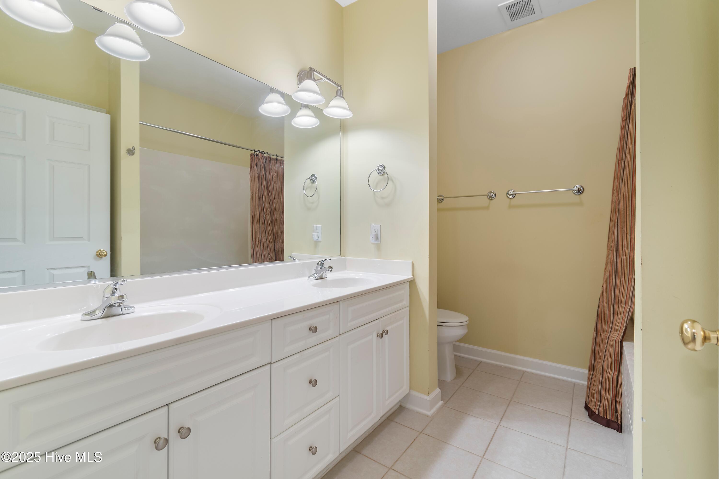 172 Clubhouse Road, Unit 1 Sunset Beach, NC 28468 - Photo 14 of 48 Primary bathroom
