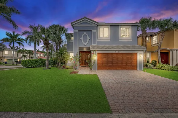 a view of a swimming pool with outdoor seating