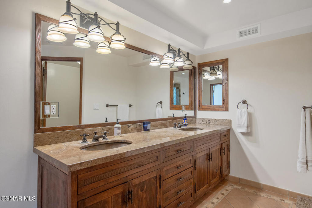 11316 Barranca Road Camarillo, CA 93012 - Photo 26 of 44 a bathroom with a sink double vanity and a mirror
