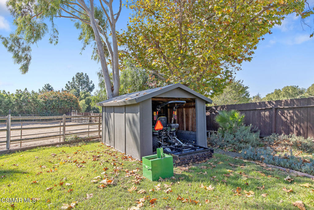 11316 Barranca Road Camarillo, CA 93012 - Photo 33 of 44 a view of a backyard with wooden fence and potted plants