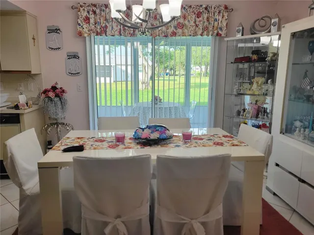 a dining room with a window and dining table