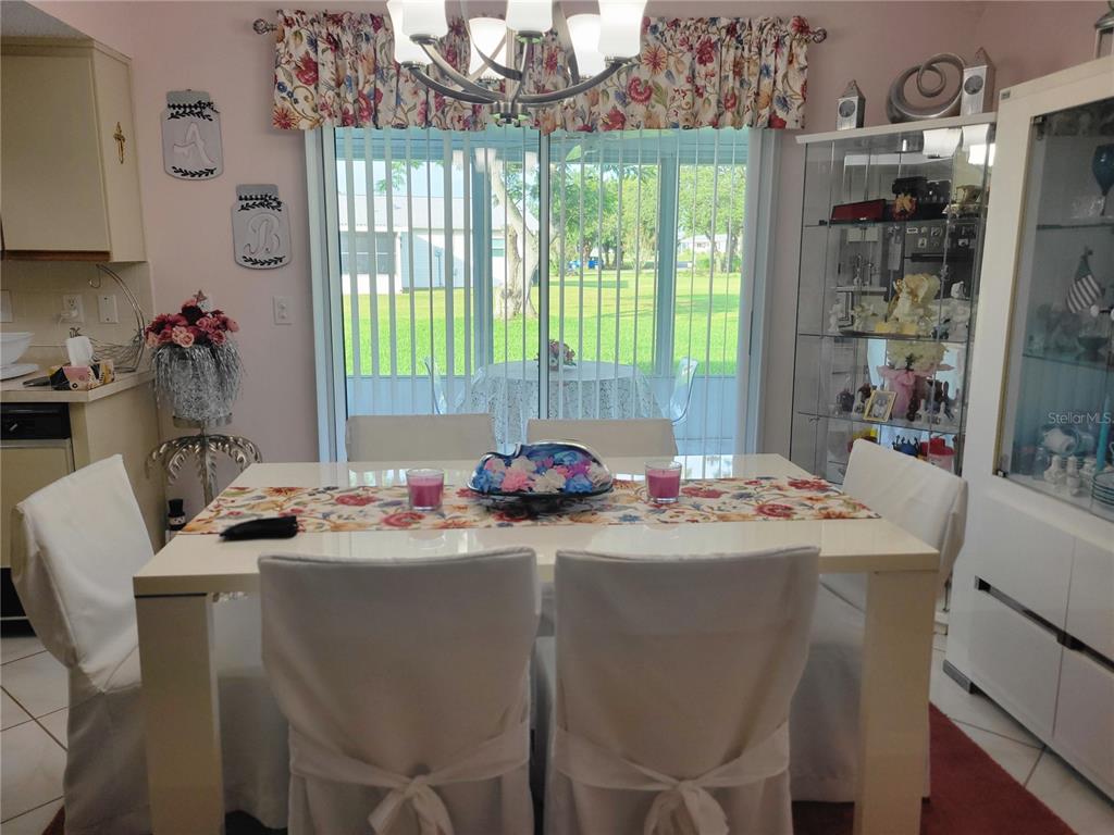 10967 Southwest 65th Avenue Ocala, FL 34476 - Photo 7 of 16 a dining room with a window and dining table