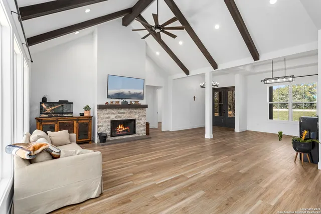 a living room with furniture and a fireplace