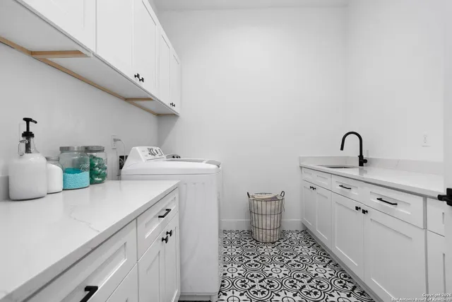 a bathroom with a sink toilet and