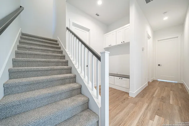 a view of staircase with white walls and white walls