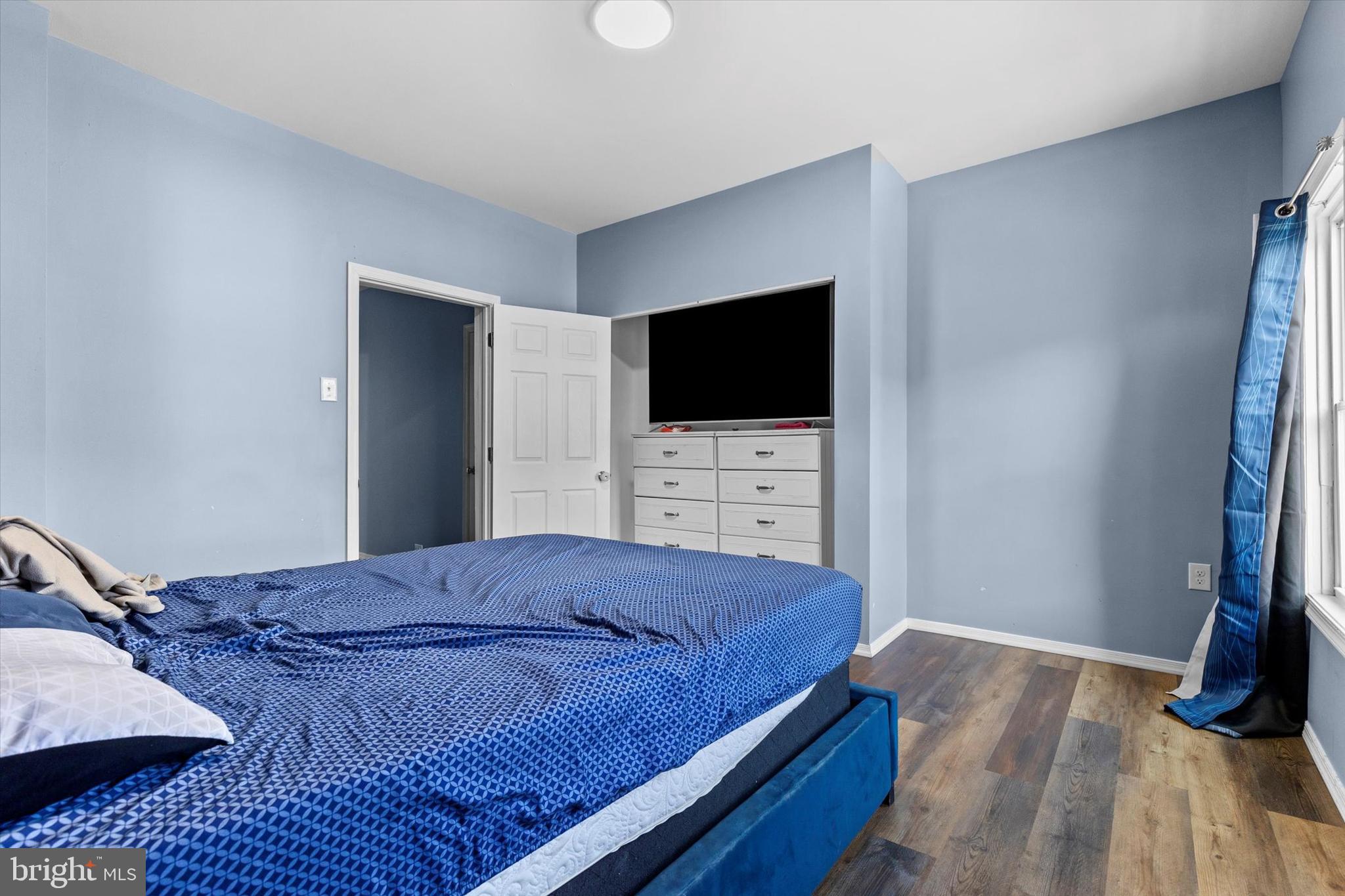 826 South Beaver Street York, PA 17403 - Photo 13 of 26 a bedroom with a bed and a flat screen tv