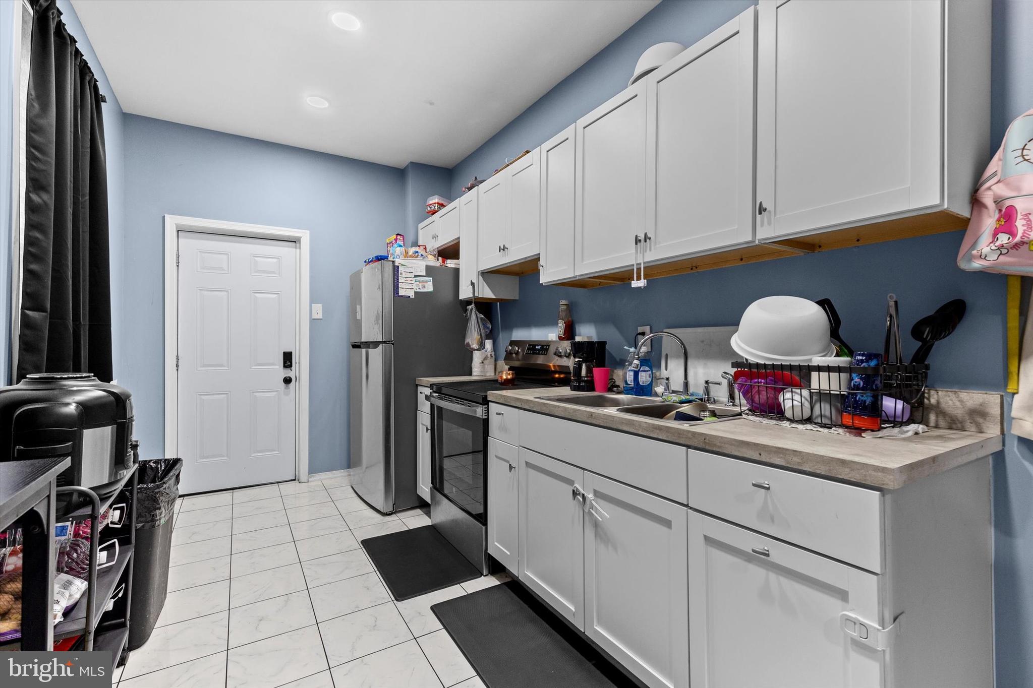 826 South Beaver Street York, PA 17403 - Photo 6 of 26 a kitchen with stainless steel appliances granite countertop a sink dishwasher stove and refrigerator with cabinets