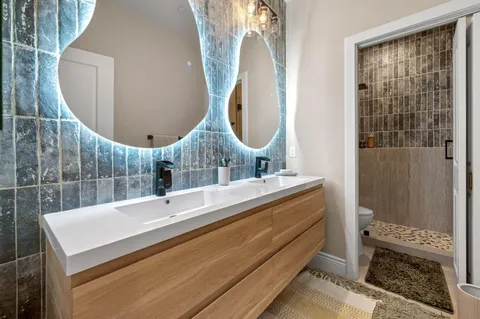 a bathroom with a shower and a toilet