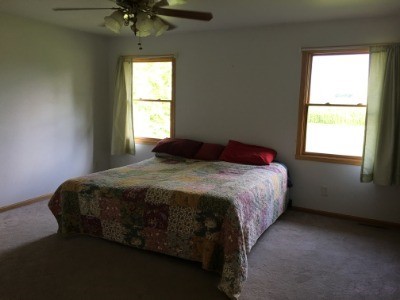 25700 Indian Ridge Road Sterling, IL 61081 - Photo 22 of 27 a bedroom with a bed and a window