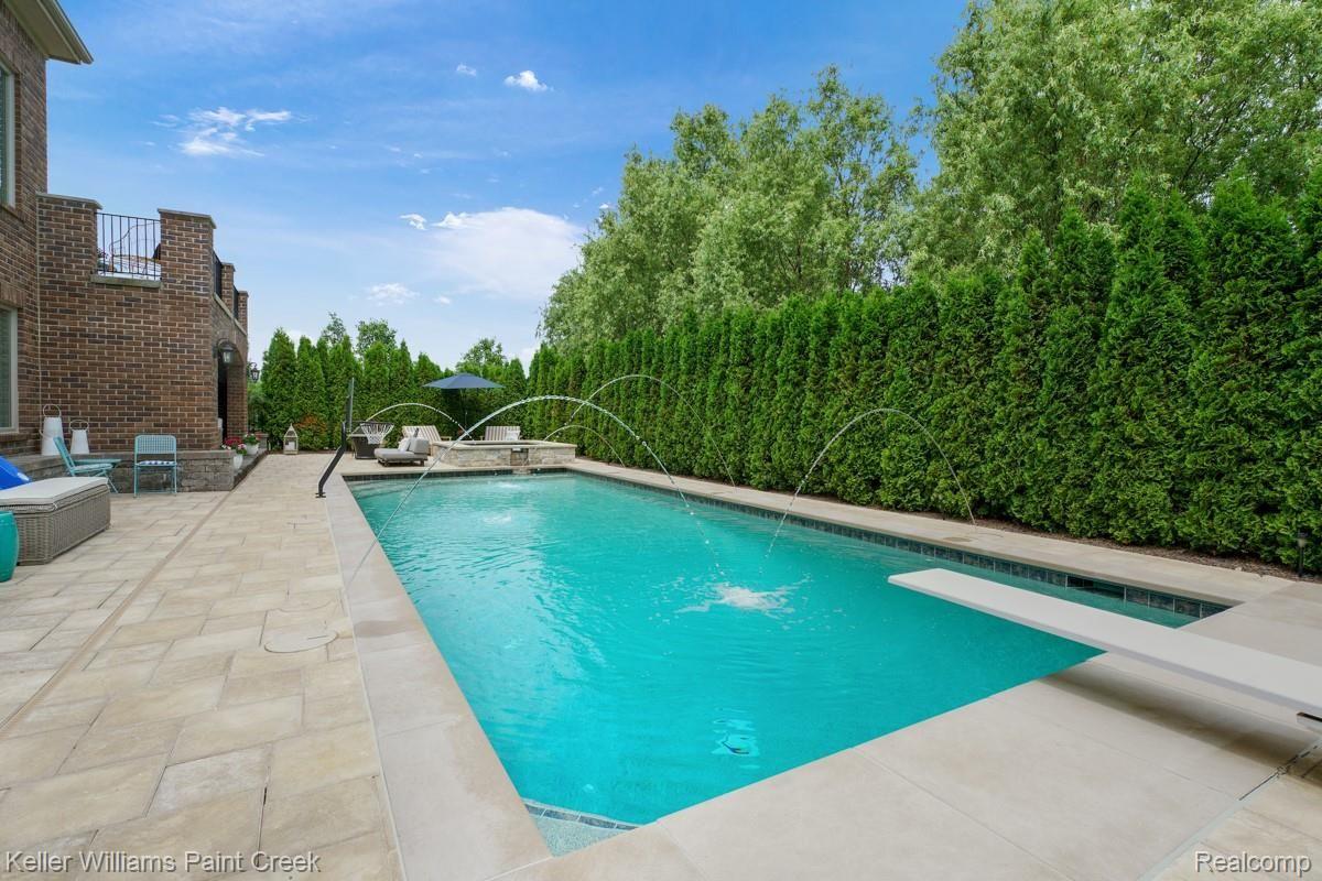 2888 North Addison Circle Rochester, MI 48306 - Photo 8 of 73 Custom Pool with Fountains is the Perfect Place to Unwind