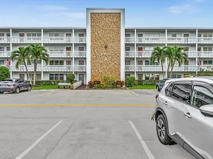 a view of a park with large trees