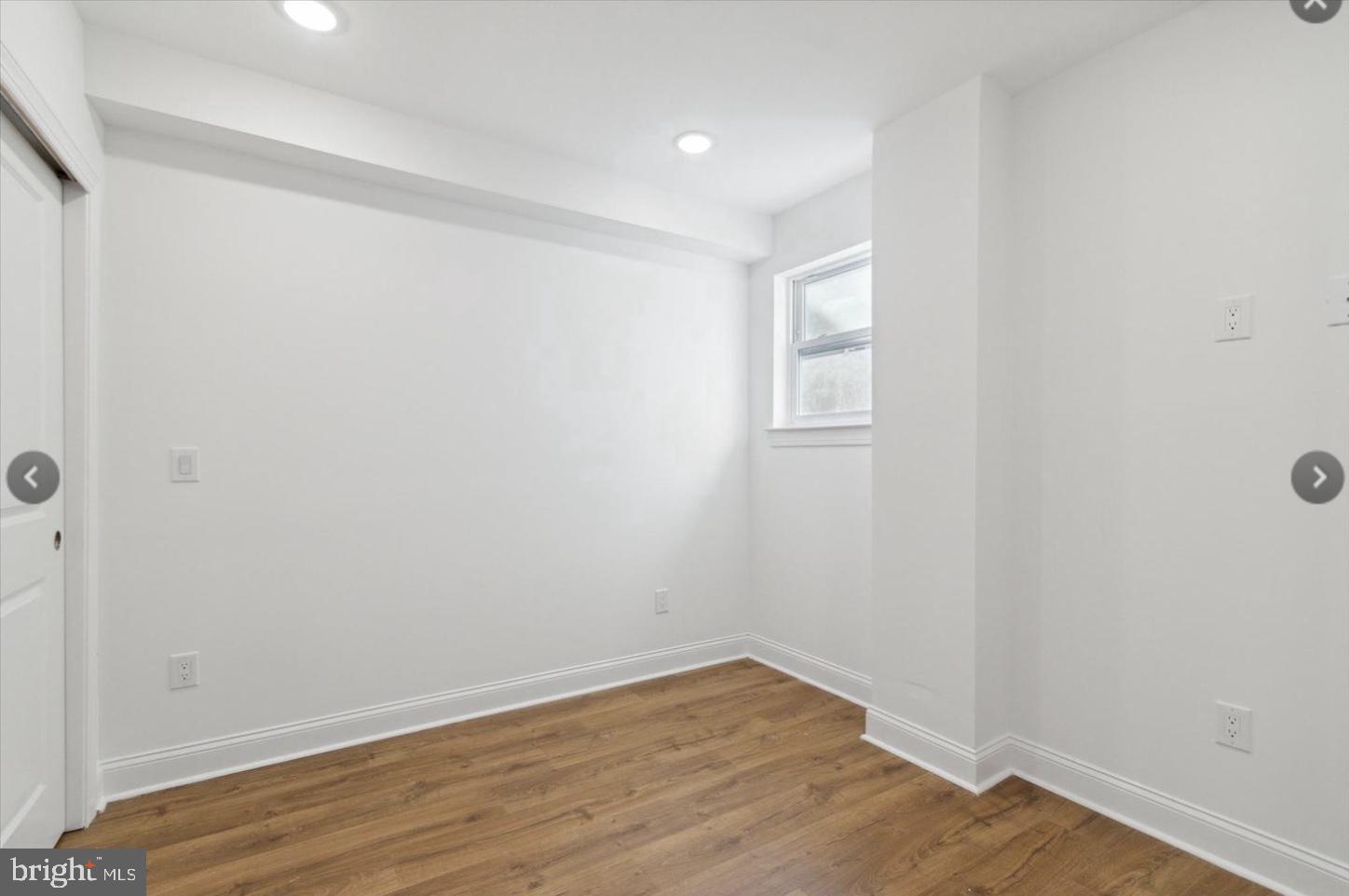 673 North Preston Street, Unit 4 Philadelphia, PA 19104 - Photo 7 of 9 a view of an empty room with wooden floor and a window