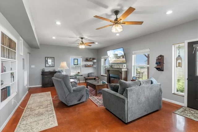a living room with furniture and a large window