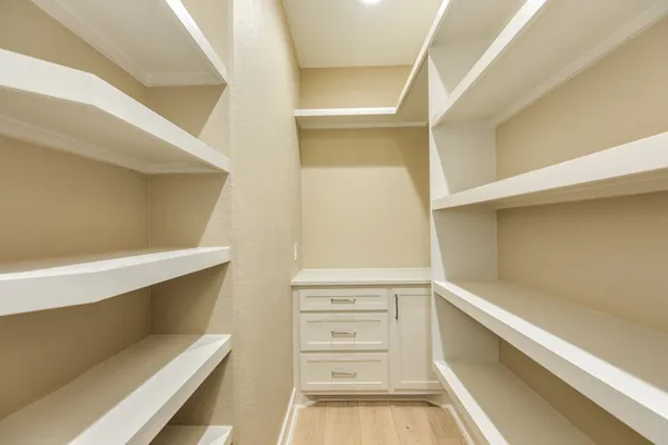 a view of an empty walk in closet