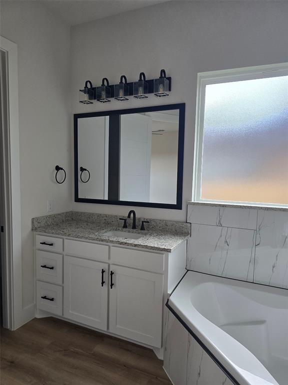 808 N Avenue East Springtown, TX 76082 - Photo 8 of 21 a bathroom with a sink and a mirror