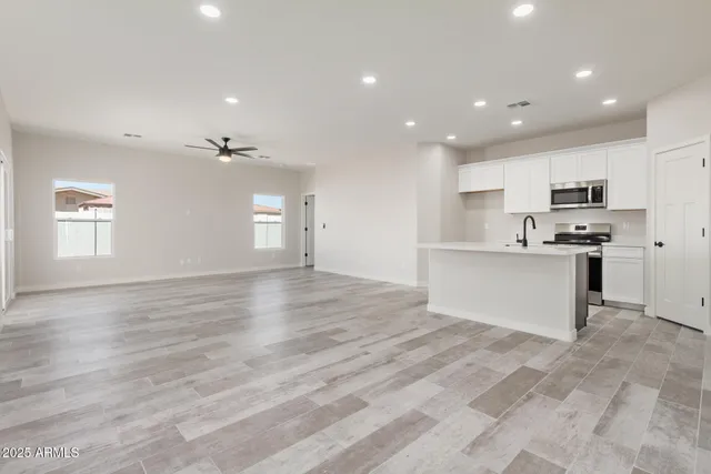 a view of kitchen with wooden floor and window