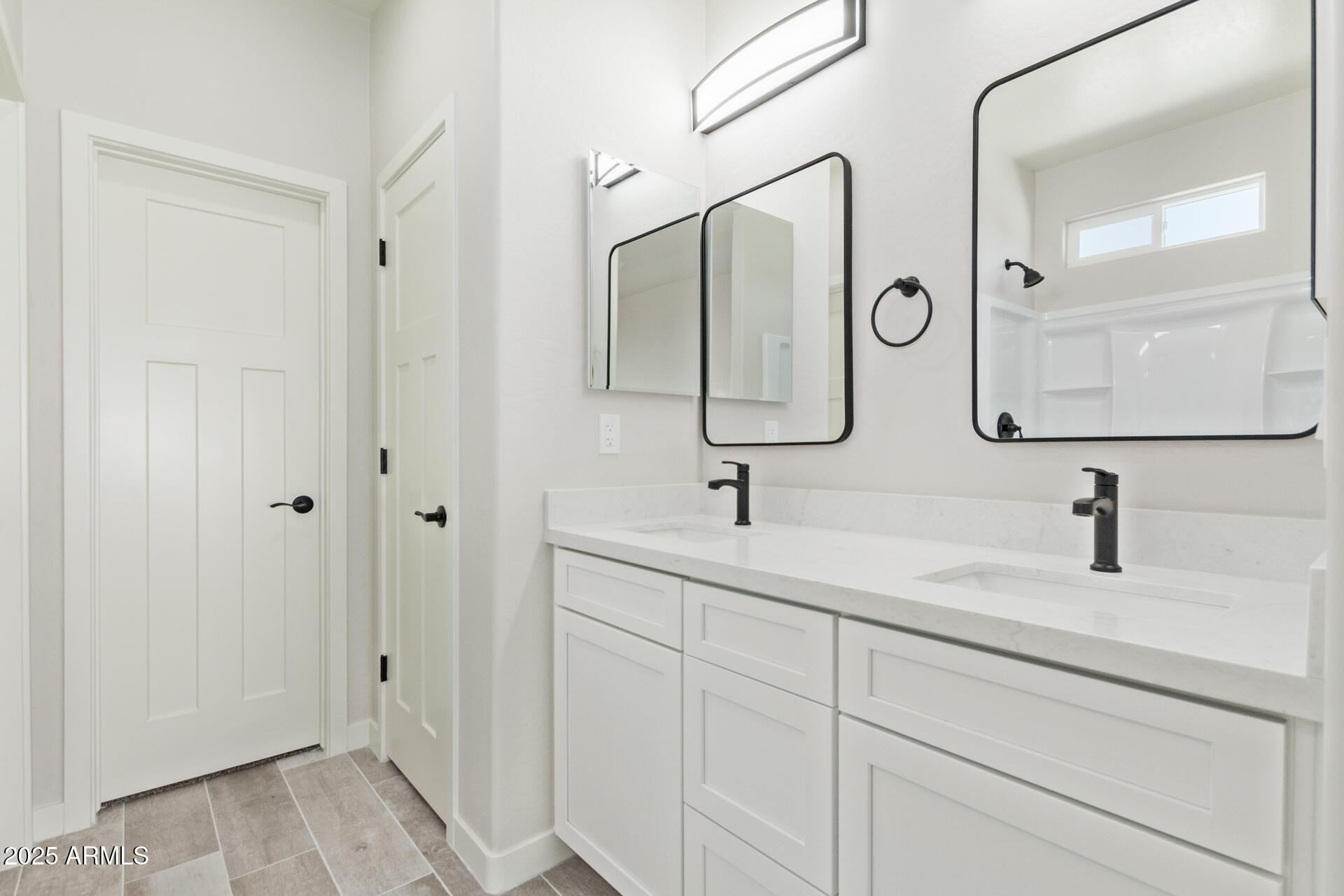 15220 South Diablo Road Arizona City, AZ 85123 - Photo 18 of 32 a bathroom with double vanity sinks and a mirror