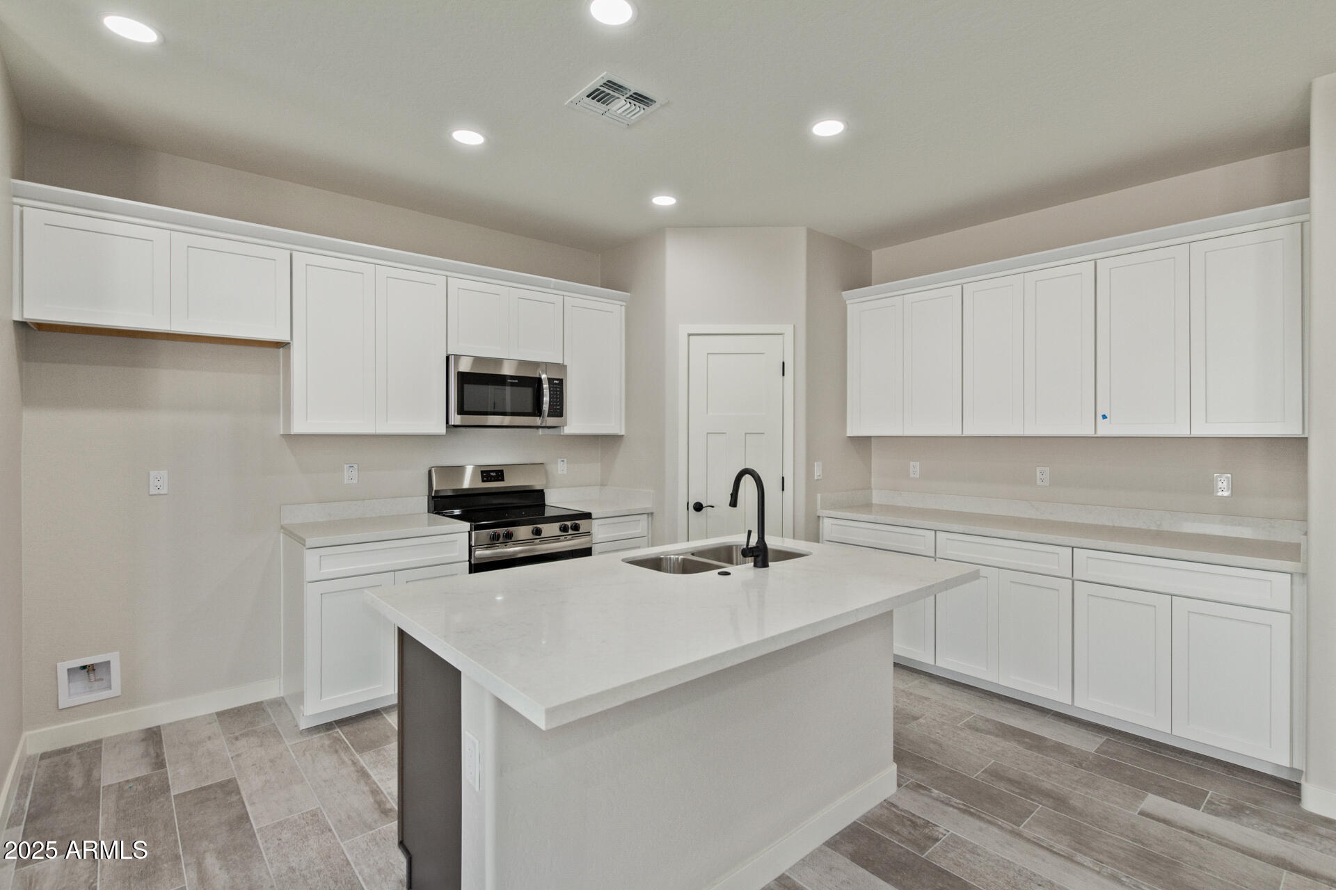 15220 South Diablo Road Arizona City, AZ 85123 - Photo 8 of 32 a kitchen with sink cabinets and microwave