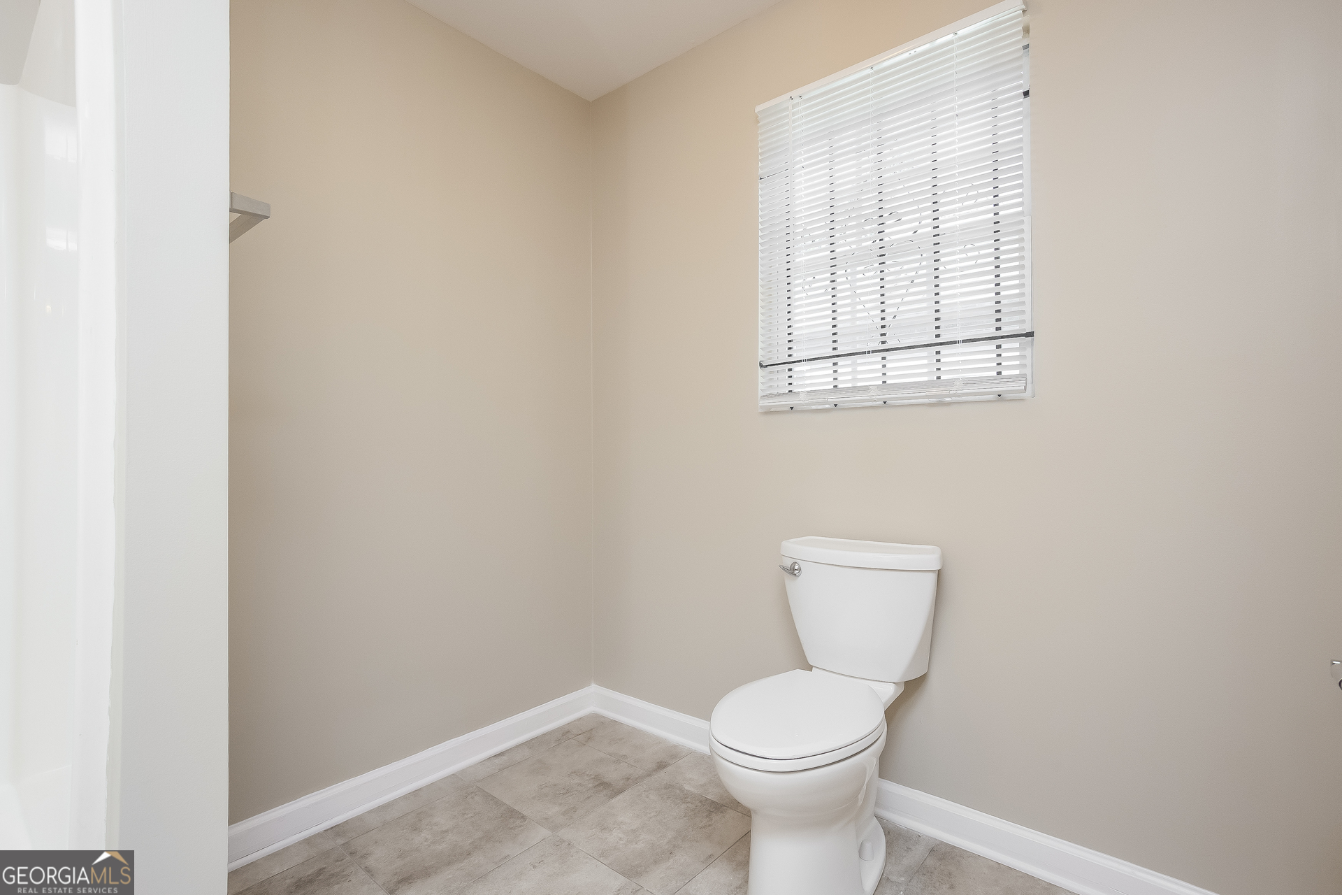 95 Howell Drive Southwest Atlanta, GA 30331 - Photo 11 of 17 a white toilet sitting next to a white cabinet