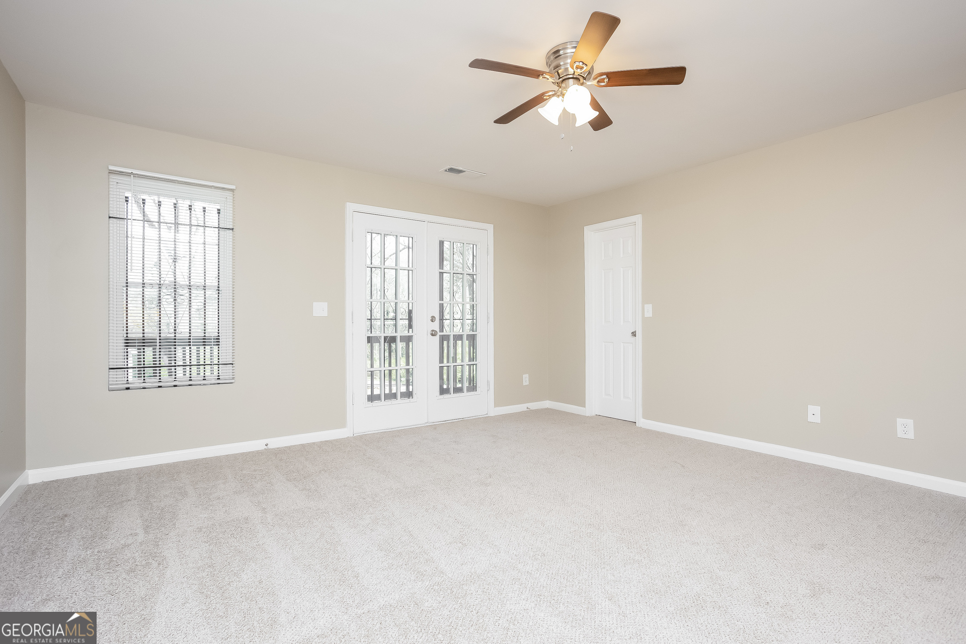 95 Howell Drive Southwest Atlanta, GA 30331 - Photo 4 of 17 a view of an empty room with a window