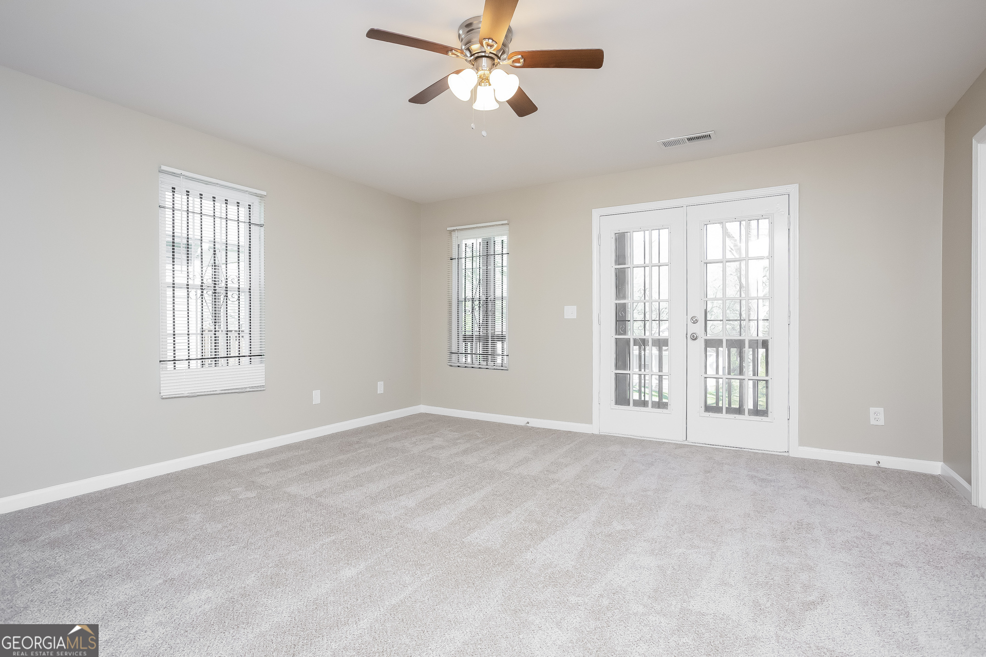 95 Howell Drive Southwest Atlanta, GA 30331 - Photo 5 of 17 a view of an empty room with a window