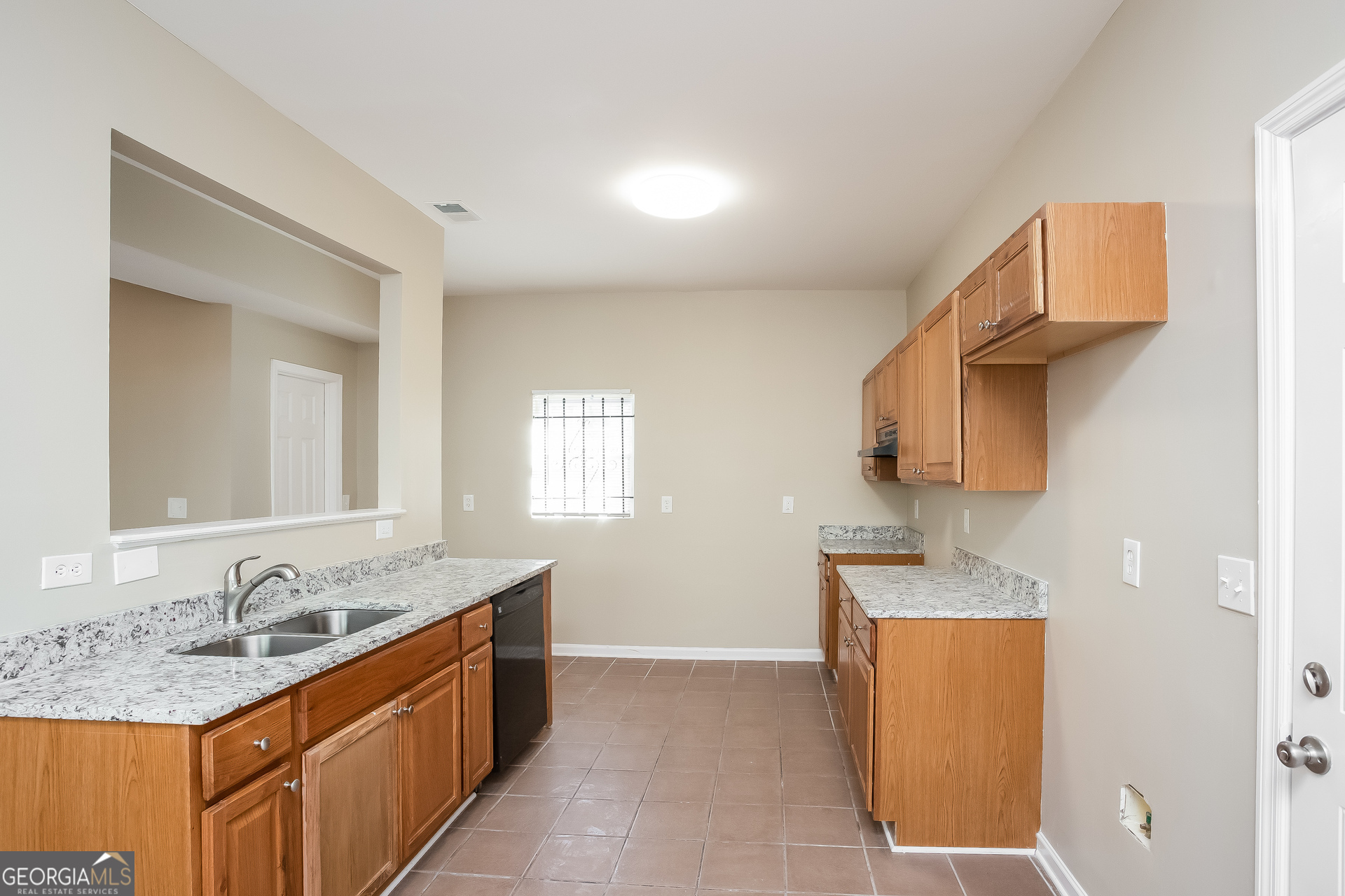 95 Howell Drive Southwest Atlanta, GA 30331 - Photo 7 of 17 a bathroom with a granite countertop sink and a mirror