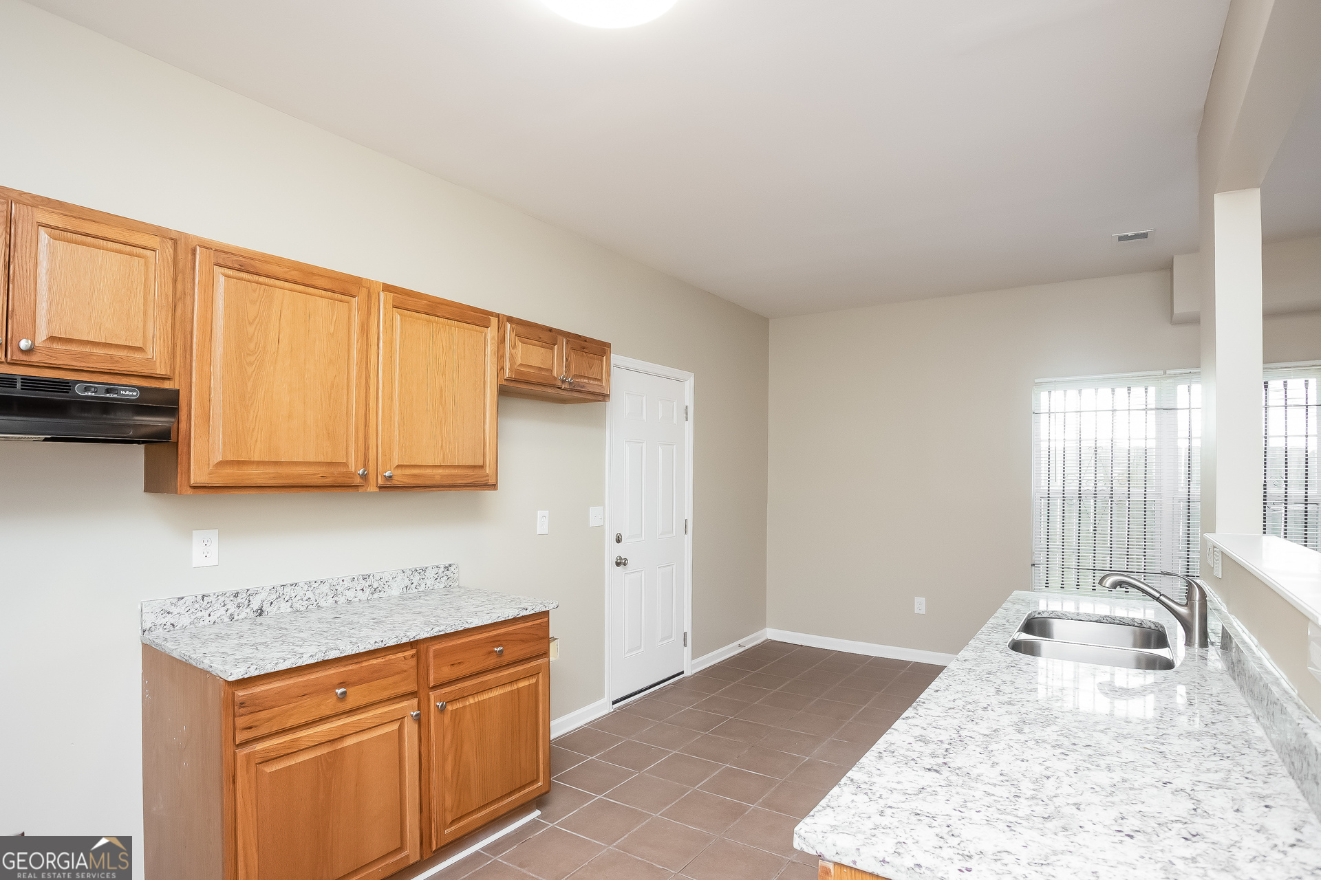 95 Howell Drive Southwest Atlanta, GA 30331 - Photo 8 of 17 a kitchen with stainless steel appliances granite countertop a sink stove and cabinets