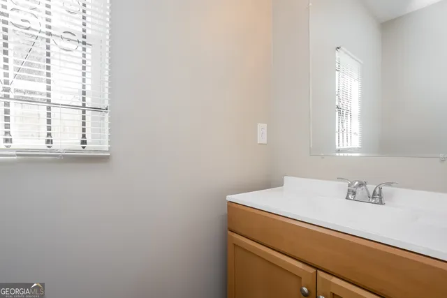 a bathroom with a sink and a vanity