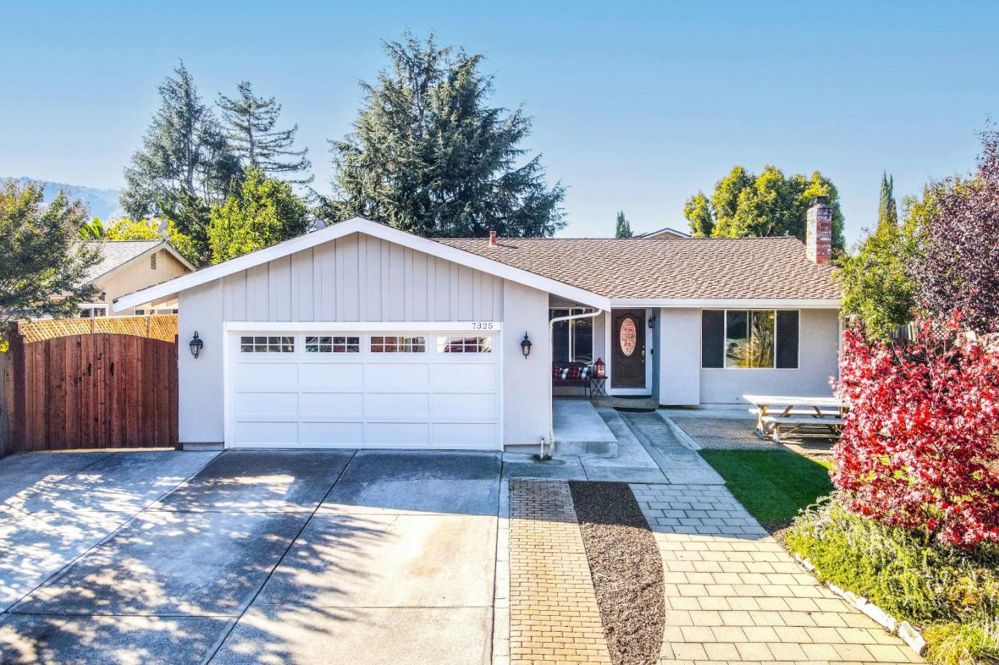 a view of house with a yard