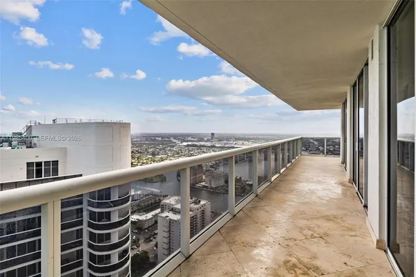 a balcony with an outdoor space