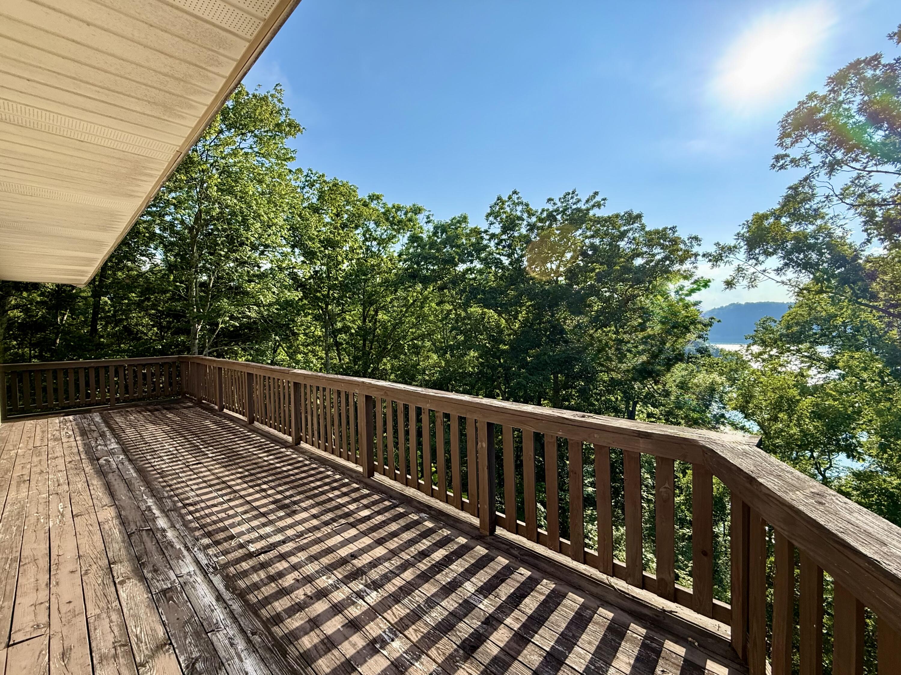 340 Hunters Paradise Road Monticello, KY 42633 - Photo 15 of 59 3rd level wrap around deck. Access from primary suite.