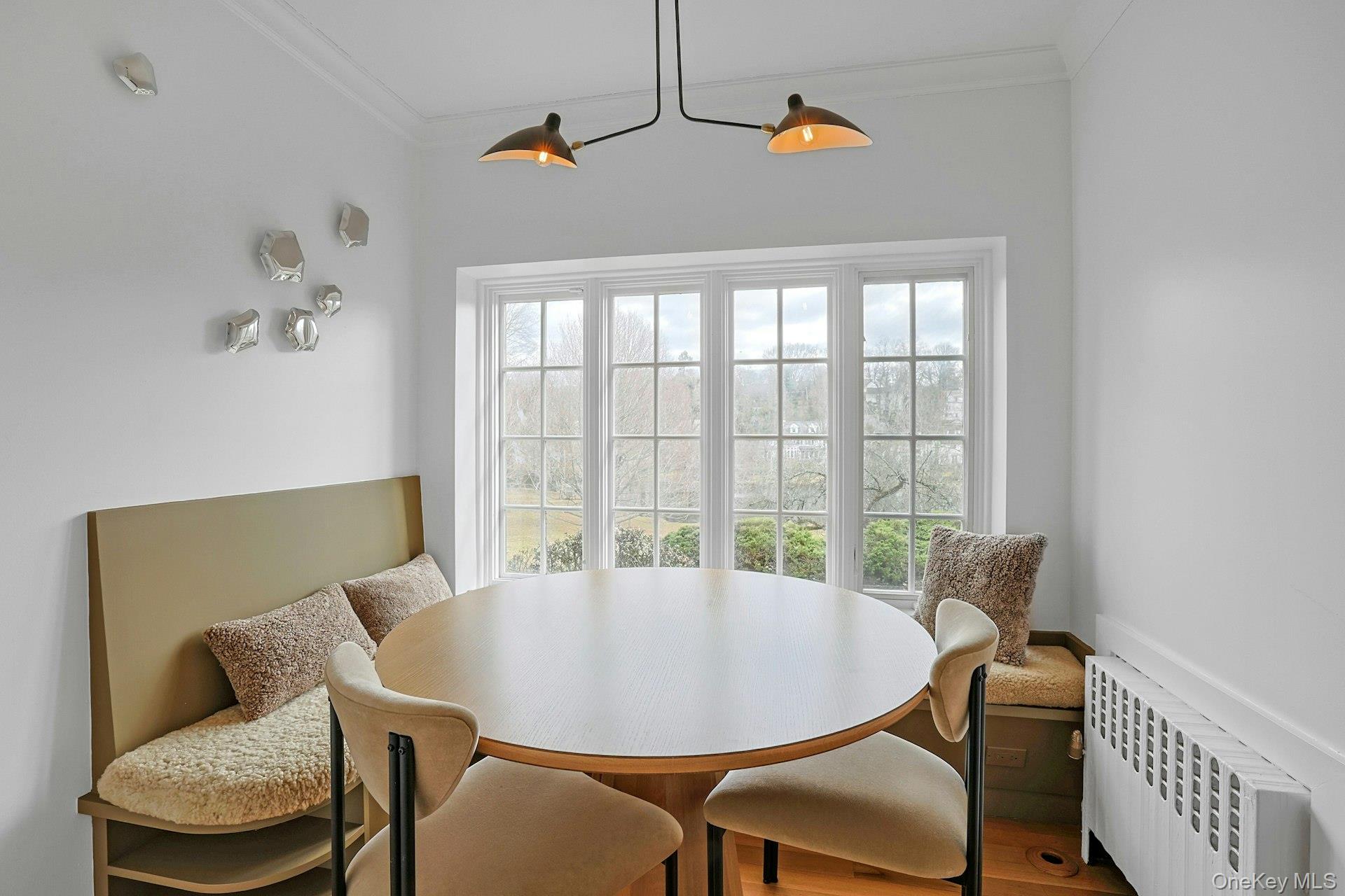21 Tisdale Road Scarsdale, NY 10583 - Photo 11 of 40 Well-appointed additional breakfast nook with cozy banquette overlooking the pond for meals with a stunning view.